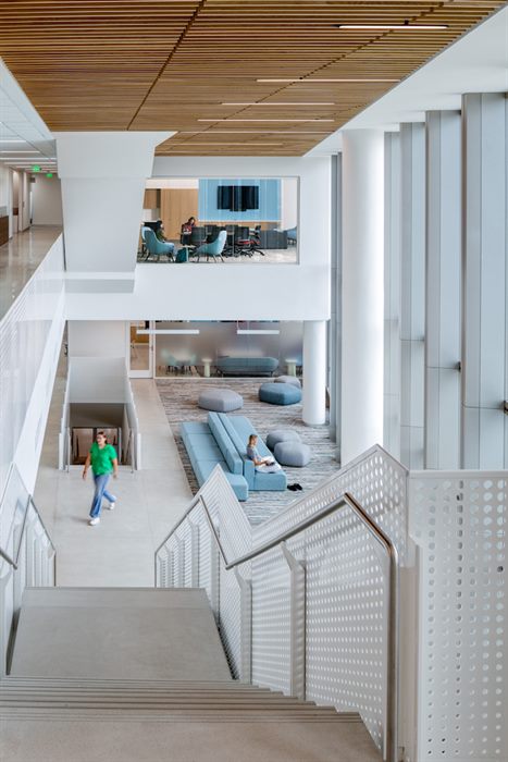 Open stairwell overlooking a student lounge in the SFESOM building